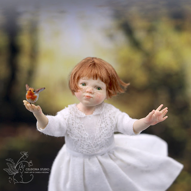 Miniature dollhouse doll: bird and child