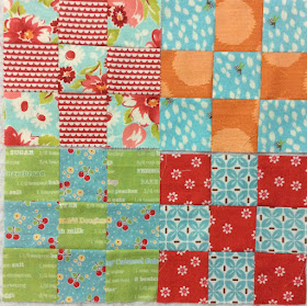 photo of four scrappy nine patch blocks