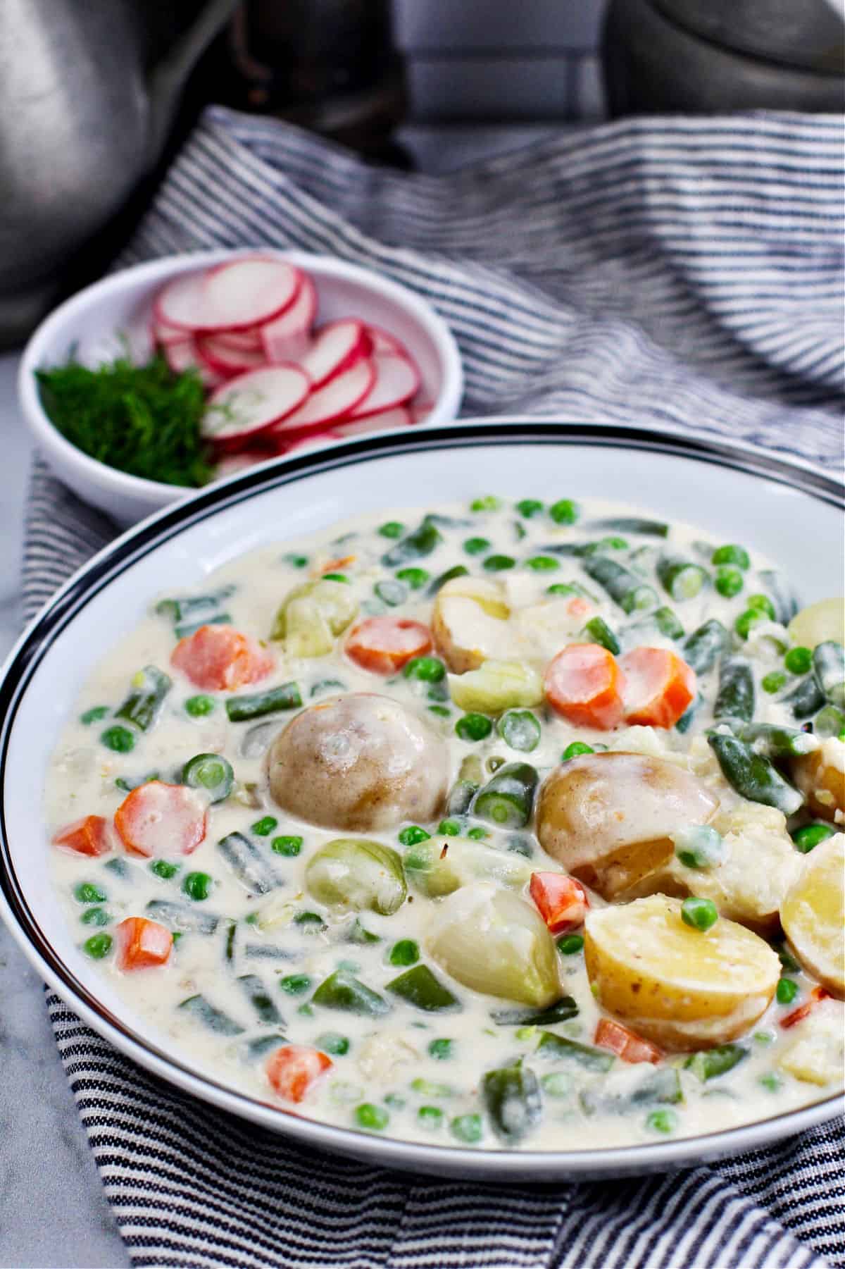 Finnish Summer Soup (Kesäkeitto) in a wide bowl.