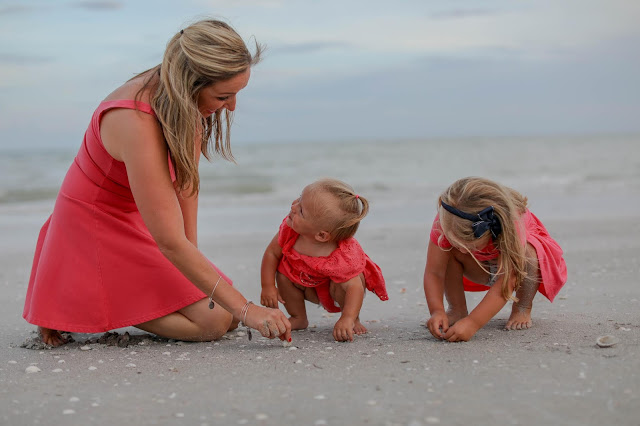 family picking shells on sanibel