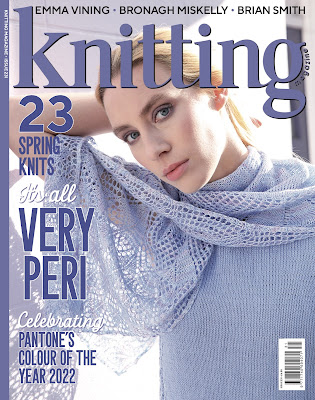 magazine cover with model wearing hand knitted shawl and top