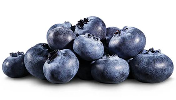 Several blueberries on a white counter.