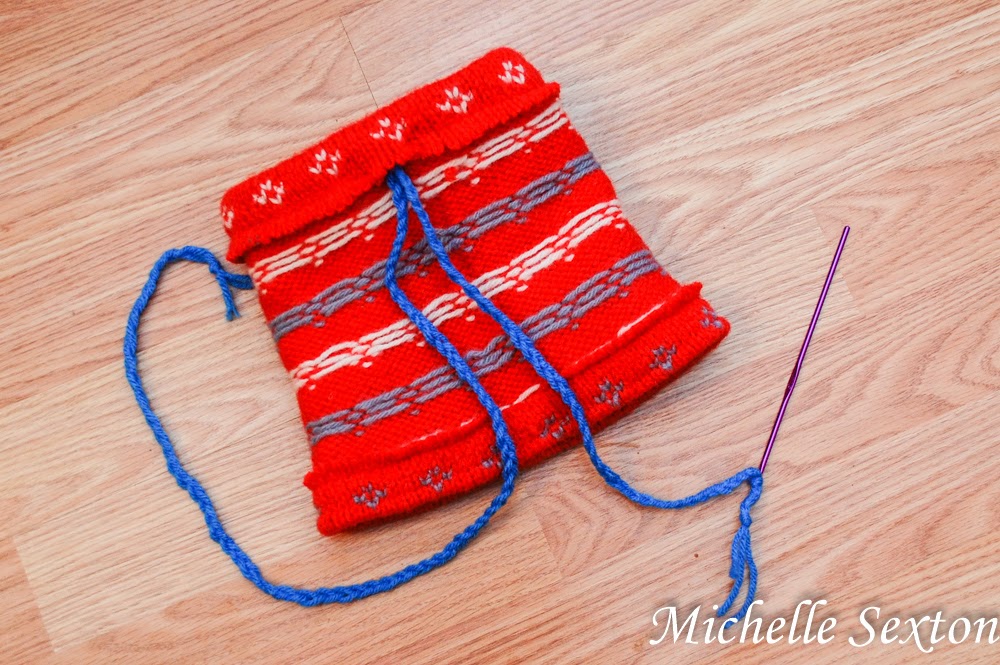 use a crochet hook to thread yarn through top opening