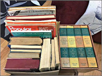 July 21, 2018 - At a yard sale lots of hard covered books for journals