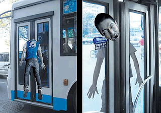 funny ads on bus door. Be care when step up on the bus or you might end up like that