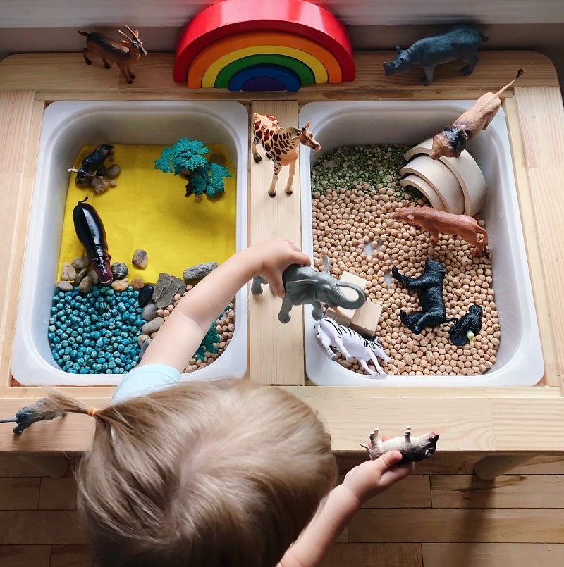 flisat table being used for sensory play