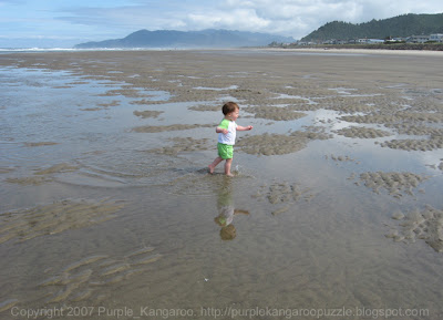 Baby E reflected in puddles