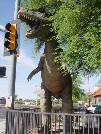 Here's the flip side a ferocious TRex chewing on the traffic light at