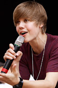 Justin bieber. he is such a awesome singerlove his songshuh in one . (justin bieber singing )