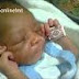 SHOCKING: A BABY BORN WITH INSCRIPTION IN HER GLUED HANDS, "JESUS IS COMING BACK" IN ABUJA