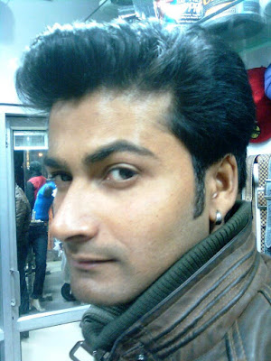 The Indian Nose For Business. A Business Owner in Suburban Delhi poses and shows off his earings too. Actor Material?