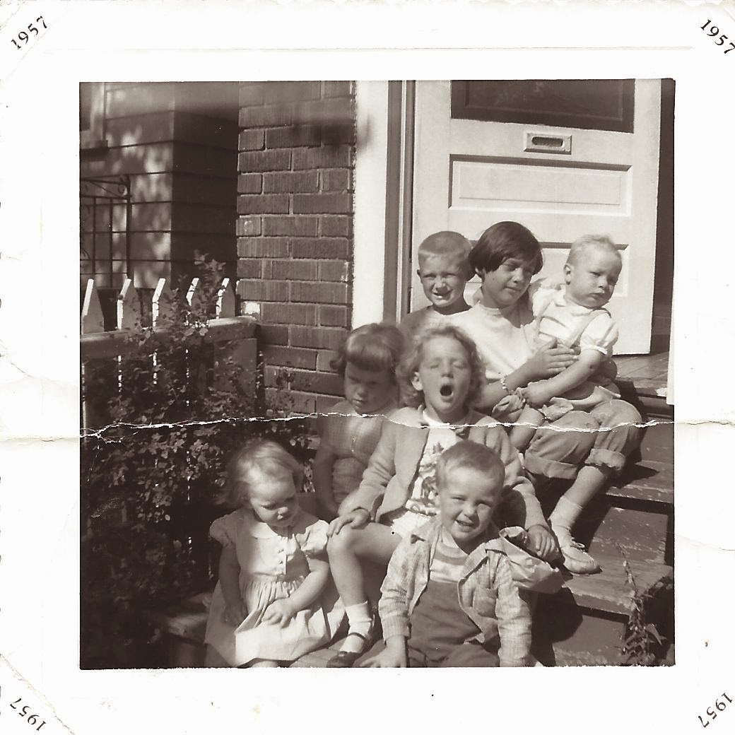 Image: Seven children sitting on the front stoop, by Catherine McDiarmid-Watt