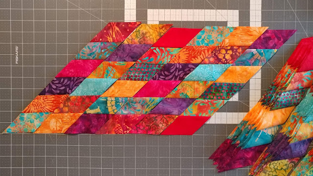 Scrappy Lonestar quilt using Empress Garden fabrics by Island Batik