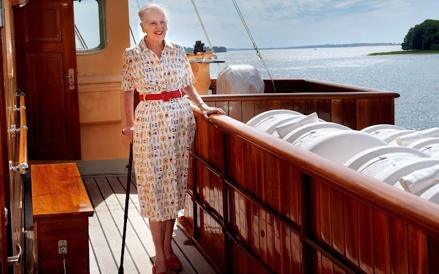 Christian IV was King of Denmark and Norway. Queen Margrethe II wore a beige marine -themed print midi silk shirt dress