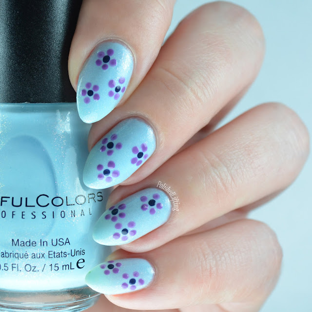 Blue nail polish with flowers