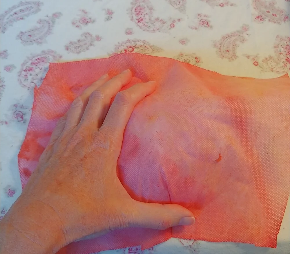 lay the fabric over the stuffing