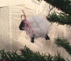Painted sheep ornament made with yarn
