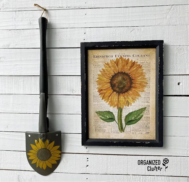 Photo of a camp style shovel painted and stenciled as garden art with chalk paint & a sunflower stencil.