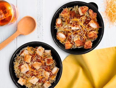 Two Bojangles Chicken Rice Bowls - one with grilled chicken and the other with Chicken Supremes.