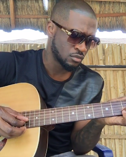 Peter okoye playing juitar 