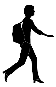 silhouette of a woman walking quickly with haversack