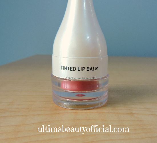 Cailyn tinted lip balm with cover and brush attached