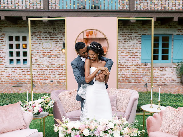 bride and groom in front of wedding lounge