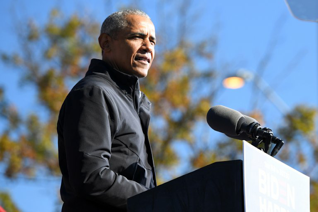 FILE PHOTO: Former President Barack Obama addresses voters one day before the election, in Atlanta, Georgia, U.S., November 2, 2020. REUTERS/Brandon Bell/File Photo