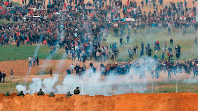 FRIDAY, At least 15 Palestinians reportedly dead and over 1400 injured in confrontations with Israeli forces armed with rubber bullets, tear gas and live rounds during a protest - match towards and around a mesh fence that separates Gaza from Israel on the first day of protest scheduled to last six weeks.