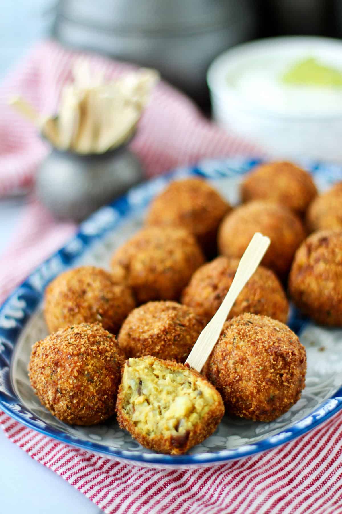 Spicy Salmon and Potato Croquettes balls on a platter.