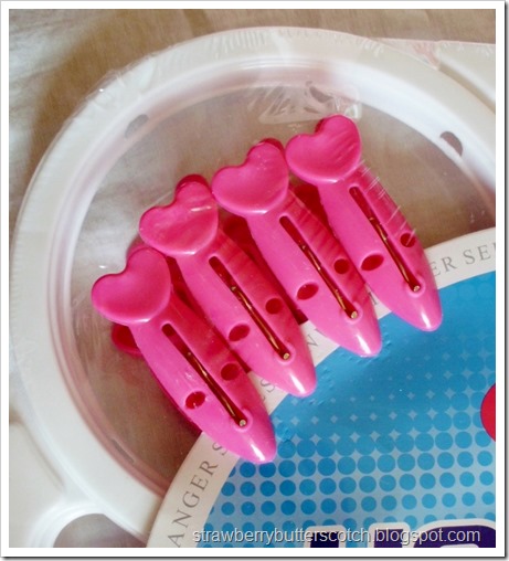 Close up of pink clips on laundry rack Close up of pink clips on laundry rack