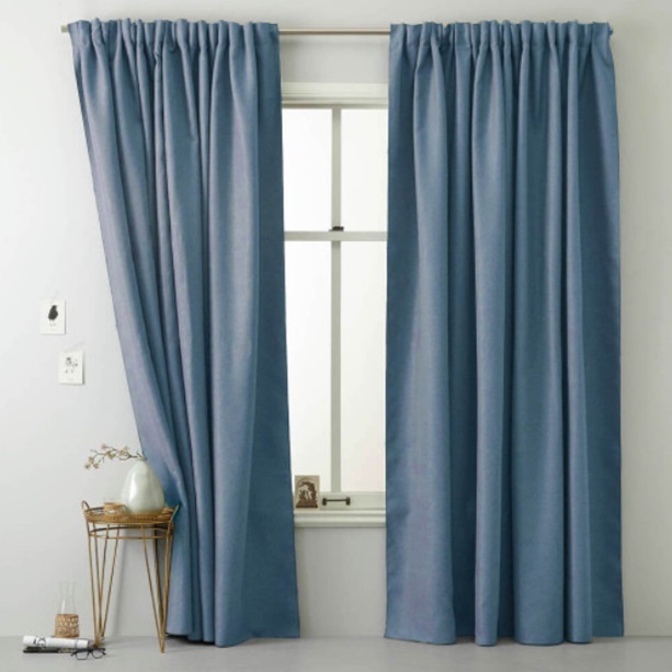 polyester blue curtains on a window