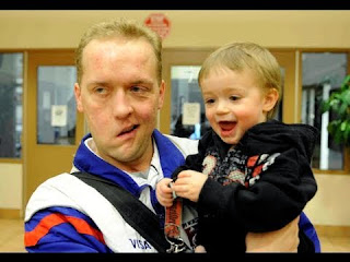 Photograph of American figure skater Paul Binnebose and his son