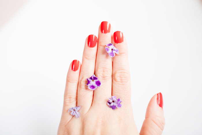 tiny purple flowers on hand