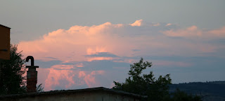 Distant clouds lit by the setting sun