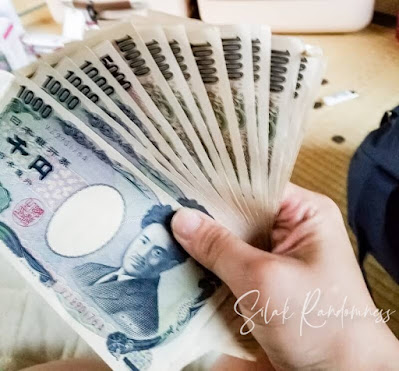 Japanese Yen bills held like a fan