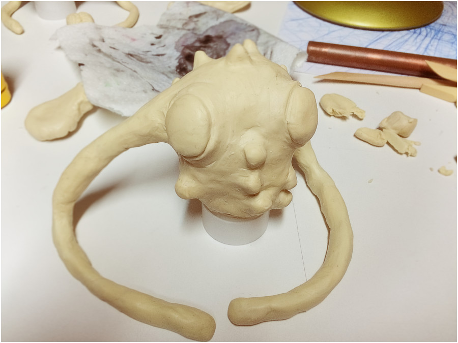 Polymer clay modeling alien creature
