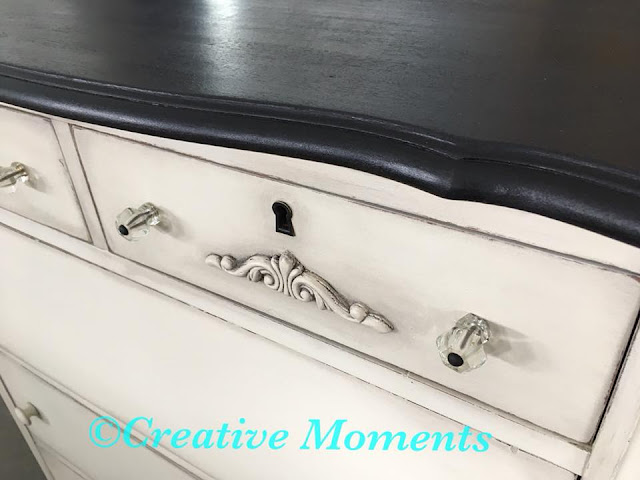 white dresser with glass knobs