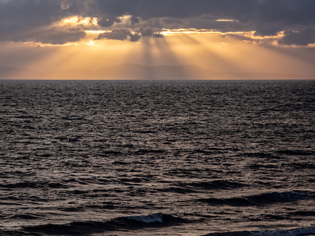 Photo of light breaking through the clouds over the Solway Firth