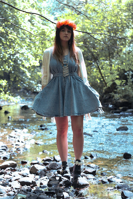 hippy girl, festival look, wearing roses and clementines floral crown in vivid orange, tassel kaftan kimono, denim pinafore topshop dress with tribal bone native american necklace with platform jeffrey campbell boots, British fashion, UK styling in the summer, how to get the hippy festival look.