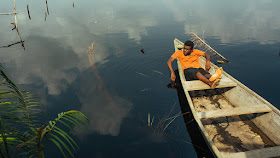 a man relaxing in a boat