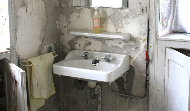 An old bathroom undergoing a renovation.