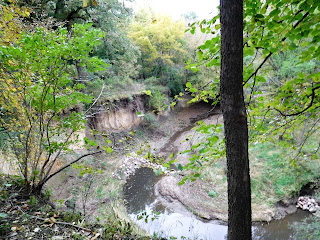 ravine with water at the bottom and trees on both sides in Sioux City, Iowa