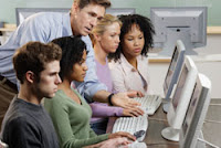 teachers sitting at computers together