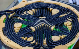 The lightweight polyphase coupling coils of the EV charging system generate a rotating magnetic field, enabling continuous power transfer.
