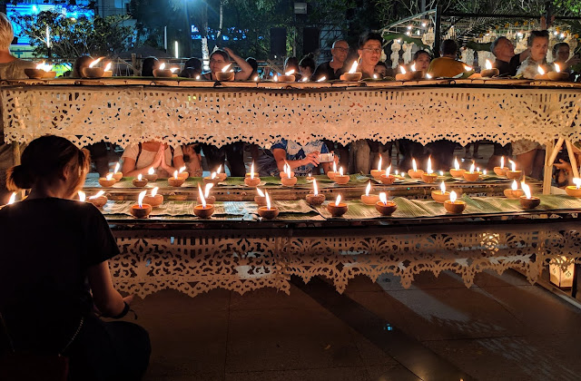 Lighting candles and making prayers in Chiang Mai, Thailand