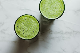 2 glasses of green juice from a birds eye view