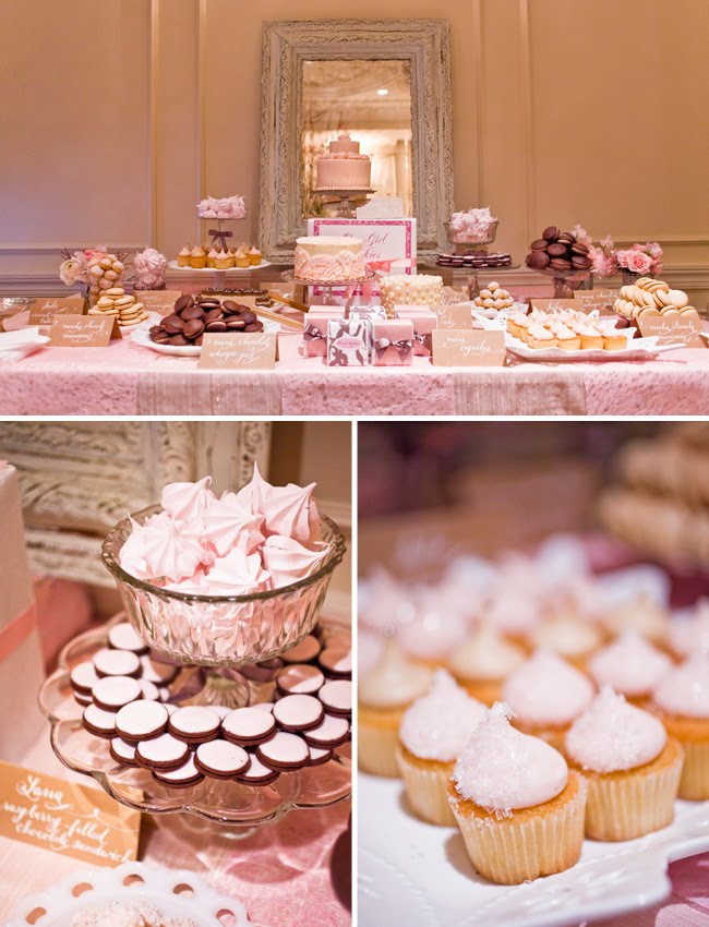 This lovely pink dessert table created by One Girl Cookies was created for a 