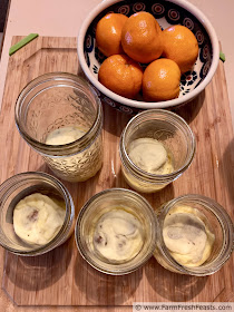 photo of sous vide sausage egg bites made in half pint canning jars, along with a dish of clementines