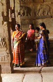 Colorful sarees liven up the monotones of Lepakshi Temple, Andhra Pradesh